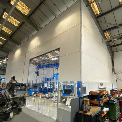 Factory layout improved with flexible PVC partitioning to create a warmer, adaptable workspace while maintaining efficient production flow.